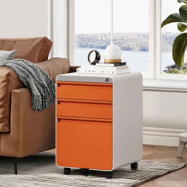 Orange and white Dripex file cabinet beside a sofa and bright window